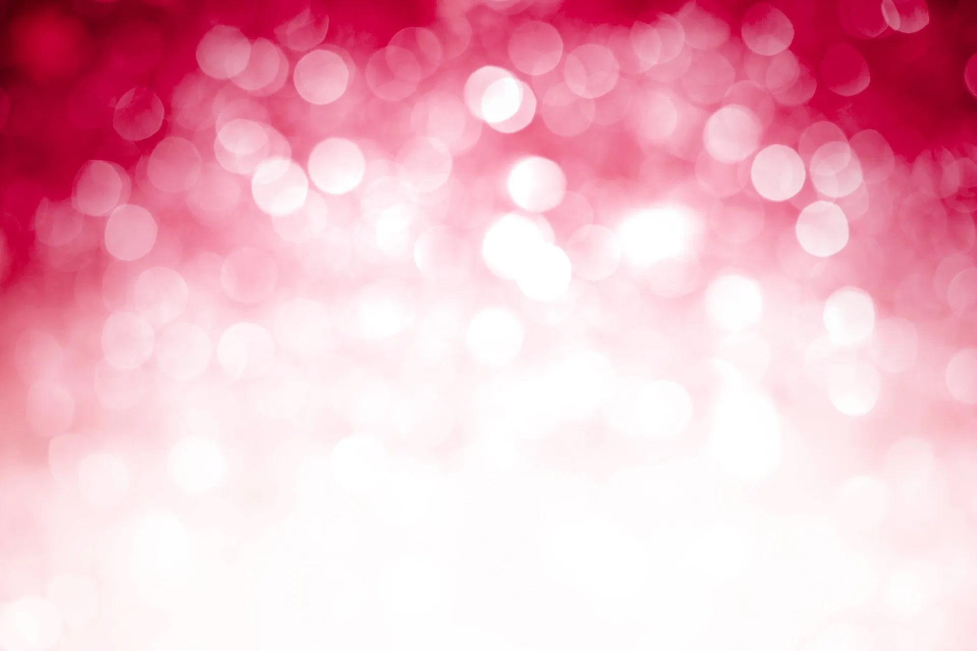 Pink sparkles fade into bright white