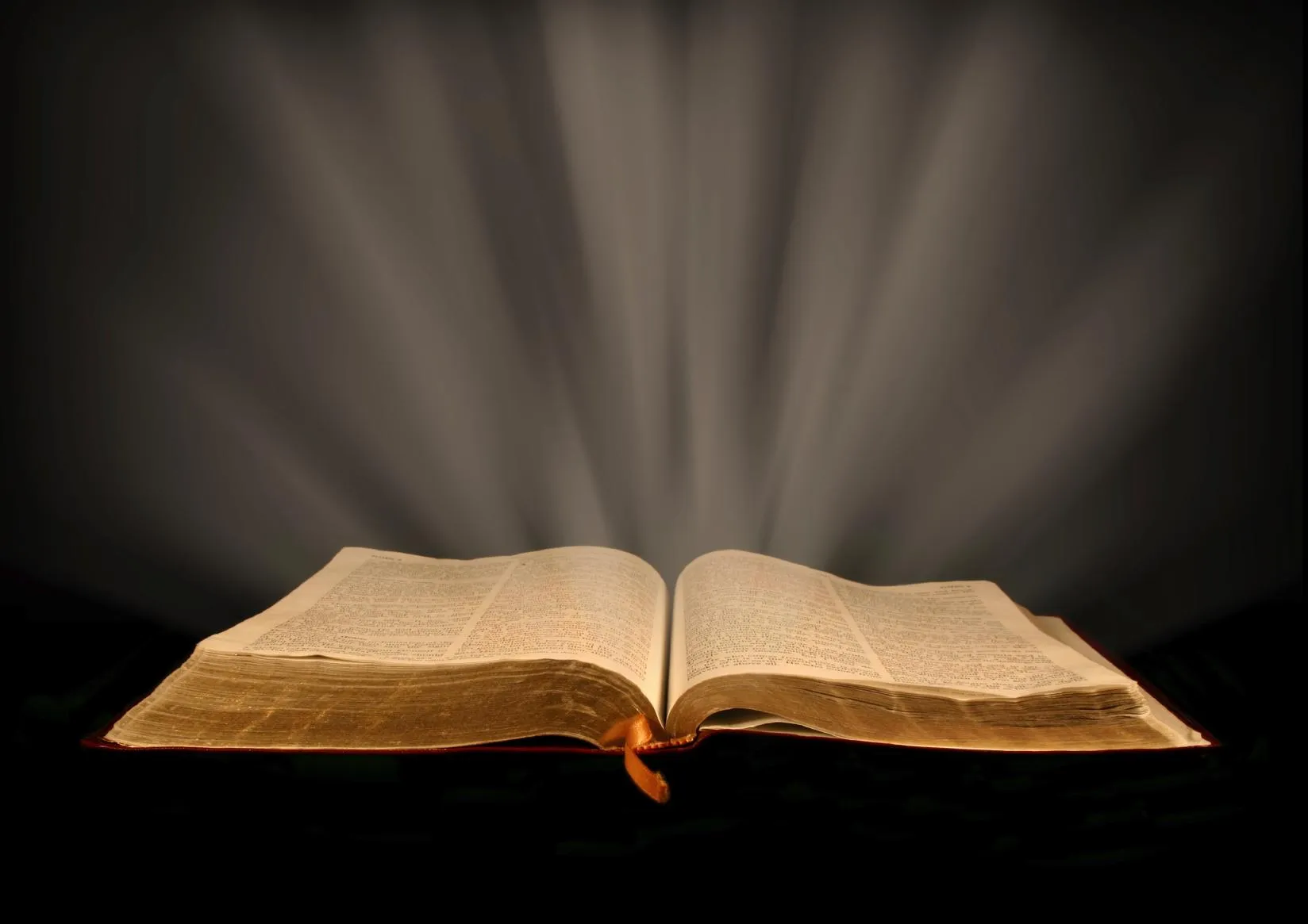 An open Bible radiating light