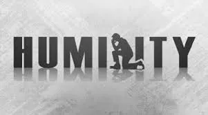 A stylized spelling of the word Humility with a kneeling person replacing the L in Humility.