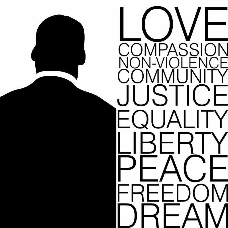 The silhouette of Martin Luther King Jr with inspiring words beside him.