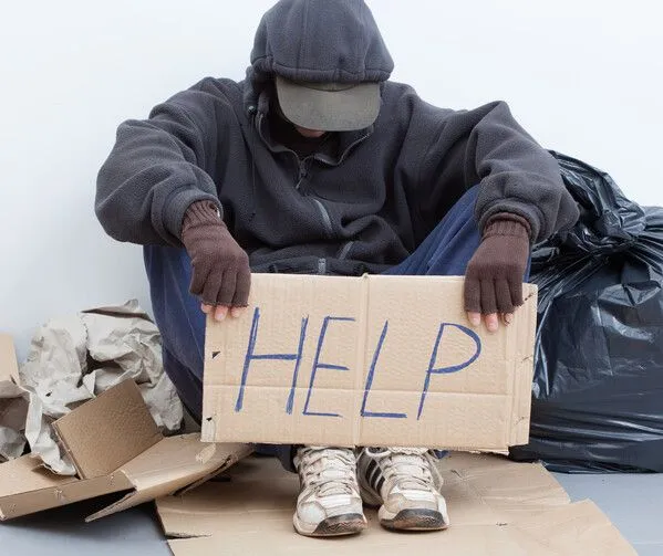 The Beggar at the Church Door