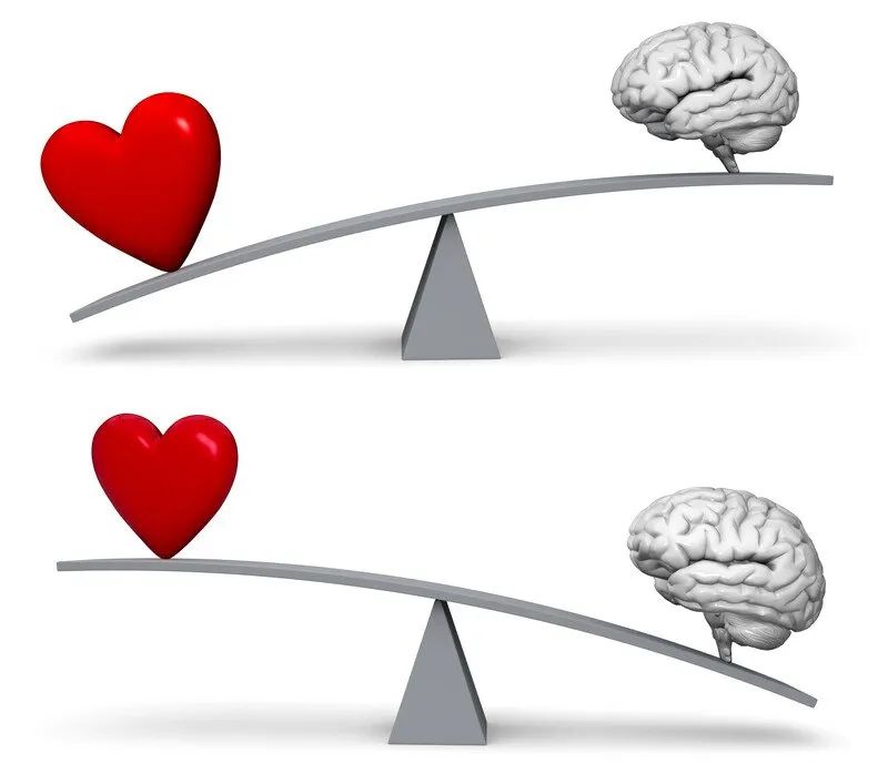 A brain and heart on two seesaws, with either rising or falling.