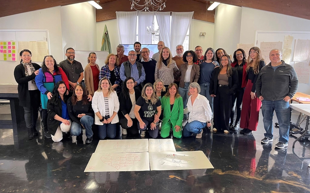 A group of UMFNE members gather for a team photo after completing a leadership development exercise