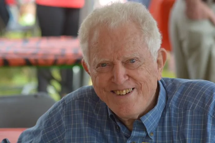 A picture of an older man looking at the camera.